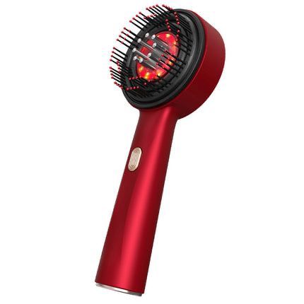 Red hair dryer with brush attachment on a white background
